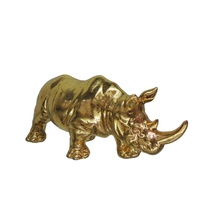 Statue de rhinocéros en résine dorée debout sur une roche, porte-bougie