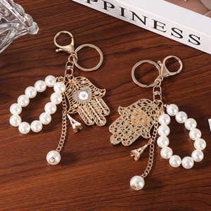 Factory Wholesale Evil Eye Hamsa Hand <strong>Keychain</strong> Pearl Beaded Key Ring Metal Hollow Pendant Fashion Bag Charm for Women Gift - Product Image 2