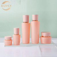 Bouteilles cosmétiques en verre rose de 30 ml, 100 ml, 120 ml en gros avec anneaux dorés pour toniques, essences, lotions et crèmes de nuit