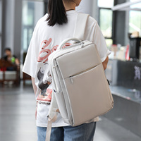 Sac à dos multifonctionnel pour ordinateur portable avec grande poche avant zippée, porte-bouteilles double face intégrés et port de charge USB