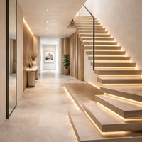 Escalier flottant avec main courante intégrée et éclairage LED pour une utilisation nocturne sécurisée dans les espaces duplex et loft