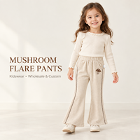Pantalon évasé ivoire pour filles avec applique champignon, bordure de jambe en zigzag et poches latérales pour collections de vêtements pour enfants en gros et sur mesure
