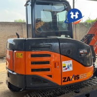 Mini-excavatrice sur chenilles Hitachi ZX65USB-5A d'occasion bien entretenue, modèle 2023, 6,5 tonnes, avec inspection vidéo du moteur, du pompe et des roulements hydrauliques.