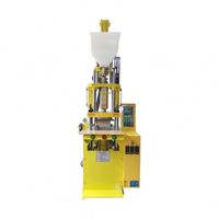 Machine de moulage par injection de plastique de type vertical pour semelles de chaussures