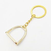 Porte-clés étrier en métal pour les amoureux des chevaux Cadeau porte-bonheur Ornements de chevaux Pendentifs Tentures Design élégant Mini étrier de cheval Porte-clés