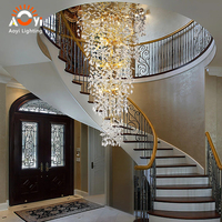 Lustre en cristal Golden Branch pour longue cage d'escalier, avec cristaux en forme de goutte d'eau, pour villa de luxe, escalier en colimaçon, hall à plafond haut