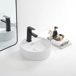 Lavabo de toilette de luxe au-dessus du comptoir en céramique lavabo rond de petite taille avec trou de débordement