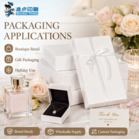 Boîte cadeau personnalisée en carton de haute qualité avec ruban, fabriquée à partir de matériaux recyclés, structure robuste et durable, élégante