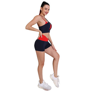 Conjunto de yoga de 2 piezas para mujer, pantalones cortos de cintura alta con bloques de color y sujetador deportivo cruzado, ropa deportiva para gimnasio - Product Image 4
