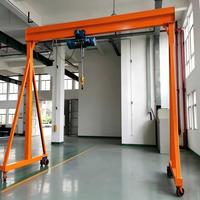 Grue portique sur pneus en caoutchouc durable, type portable, avec palan électrique 3T 5T et télécommande pour la fabrication, la logistique et l'entrepôt