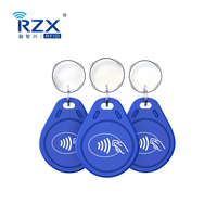 Porte-clés RFID étanches 13,56 MHz FM11RF08 prêts à être expédiés pour système d'accès aux portes, porte-clés RFID en plastique avec puce