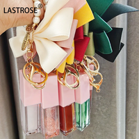 Kit d'huiles à lèvres brillantes en gros, saveur fruitée, changeant de couleur, marque privée, végétalien, rose, avec porte-clés nœud