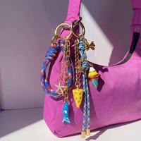 Accessoires de sac à main élégants de style occidental en alliage tressé, breloque de sac personnalisée avec logo, porte-clés