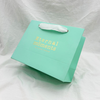 Sac en papier de luxe écologique à provisions Logo personnalisé en relief en feuille d'or pour vêtements bijoux emballage cadeau pour promotions