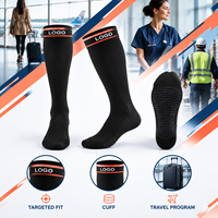 Chaussettes de compression noires avec logo, support du mollet à compression graduée, bordure large, pointe plate, avec tableau de mesure, vérifiées pour le travail