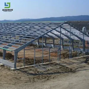 Structure <span class=keywords><strong>de</strong></span> portique préfabriquée à faible coût en acier H soudé, norme ASTM, pour hangar avicole et ferme <span class=keywords><strong>de</strong></span> poulets avec porte électrique à enroulement - Product Image 2