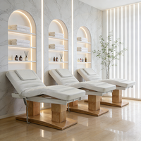 Nouvel arrivage de meubles de salon Base de grain de bois blanc Lit facial de spa de beauté Lit médical de cils de massage inclinable électrique à 4 moteurs