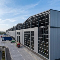 Almacén Prefabricado de Estructura de Acero Impermeable e Ignífugo con Puerta Enrollable