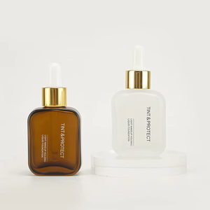 Flacon rectangulaire givré de nouveau style bouteille <span class=keywords><strong>en</strong></span> <span class=keywords><strong>verre</strong></span> blanc ambre emballage cosmétique personnalisé de 30ml <span class=keywords><strong>avec</strong></span> bouchon compte-gouttes pour sérum d'huile capillaire - Product Image 1