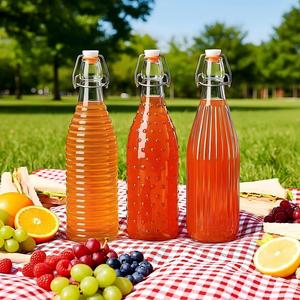 Bouteilles <span class=keywords><strong>en</strong></span> <span class=keywords><strong>verre</strong></span> rondes à bouchon basculant de 250 ml, 500 ml, 750 ml, 1000 ml pour <span class=keywords><strong>eau</strong></span> minérale et <span class=keywords><strong>eau</strong></span> gazeuse, traitement de <span class=keywords><strong>surface</strong></span> par estampage à chaud, vente <span class=keywords><strong>en</strong></span> gros - Product Image 1