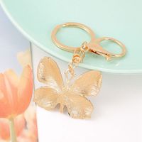 Porte-clés Papillon Créatif Scintillant et Coloré en Alliage Métallique Léger avec Strass pour Décoration de Sac à Main Femme