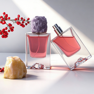 Premium 50ml Polished Clear Glass Perfume Bottles Artistic Sculpted Bottom with Resin Stone-Shaped Cap - Product Image 1