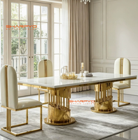 Table à manger moderne de luxe en métal avec plateau en pierre frittée marbrée et pieds en acier inoxydable créatifs pour mobilier de salle à manger d'hôtel