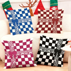Christmas checkered pillow with bow design for festive home decor - Product Image 1