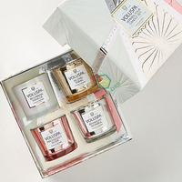 Ensemble cadeau de 4 bougies parfumées personnalisées de luxe, bon marché et uniques, dans des boîtes rigides recyclables avec emballage en feuille d'or