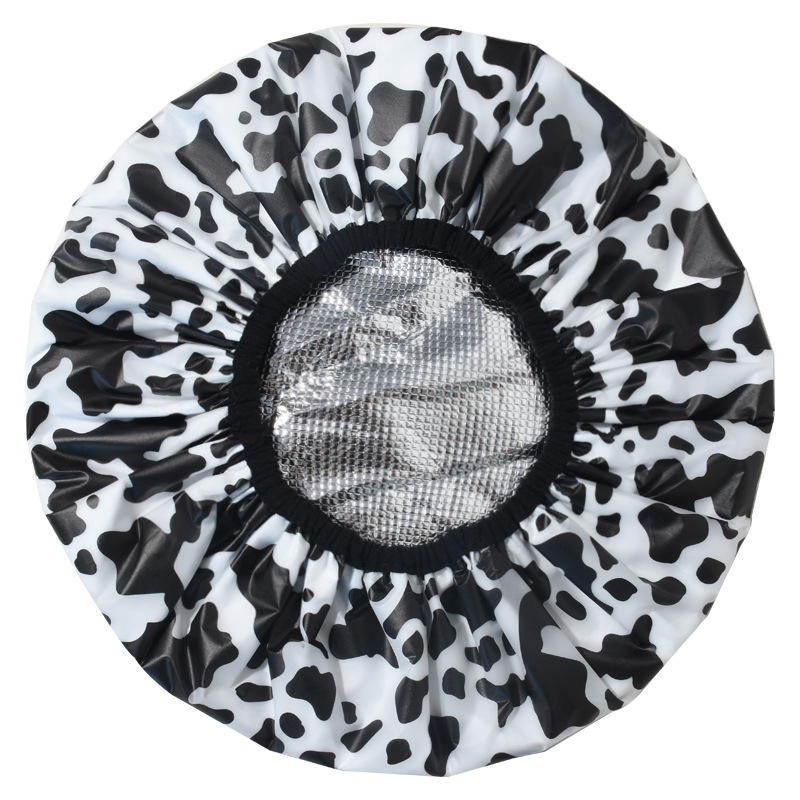 Bouchon d'huile de vache noir et blanc