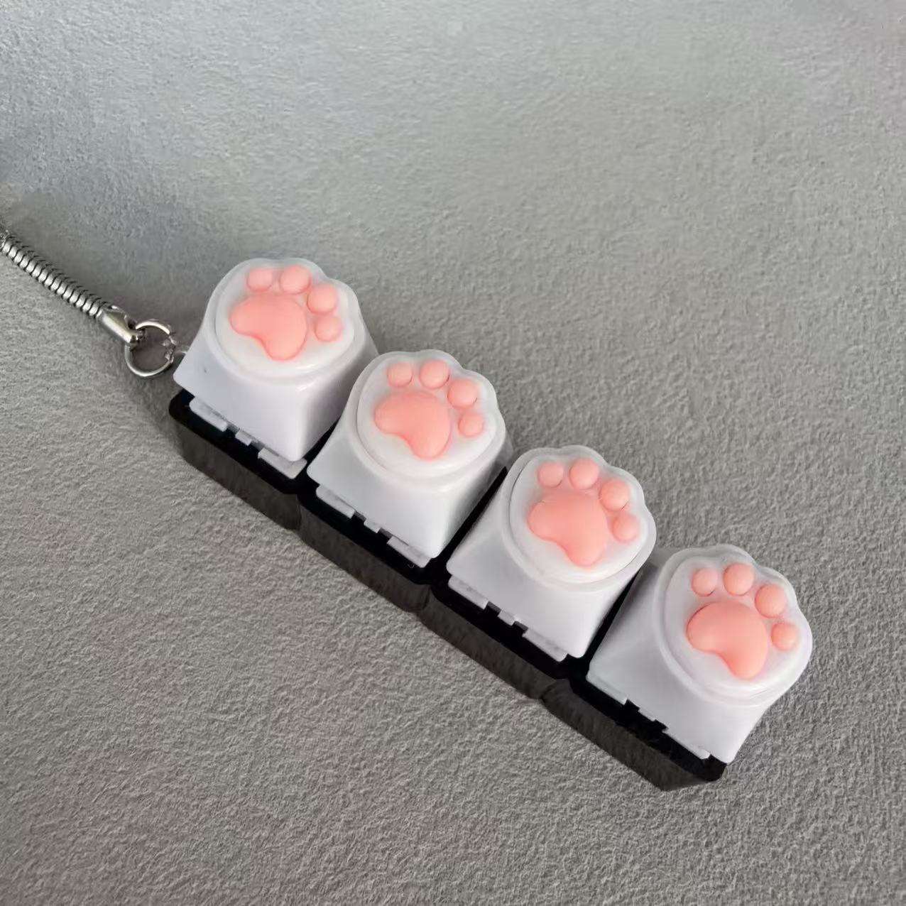 Coque noire à quatre boutons - empreinte de patte de chat blanche en silicone