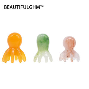 Color naranja Tamaño 5,6 CM/2,2 PULGADAS * 7,3 CM/2,87 PULGADAS Masajeador de cuero cabelludo de pulpo y herramienta Gua Sha para relajación profunda - Product Image 1