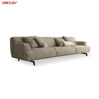 Canapé Tribeca Luxe Italien en Tissu Gris avec Plumes Canapé Moderne Salon Luxe Canapé d'Angle Modulable Pieds en Métal