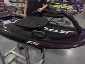 Planche de surf unisexe JetFly 09 de qualité athlétique avec moteur à essence en fibre de carbone alimenté par les eaux océaniques et démarrage électrique