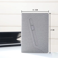 Carnet de notes A5 élégant personnalisé en tissu avec porte-stylo, idéal pour les réunions, la planification et comme journal pour les étudiants.