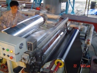 Machine de revêtement et de laminage au bitume