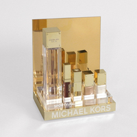 Présentoir de parfum en miroir doré en acrylique Présentoir de bouteille de parfum de comptoir de parfum