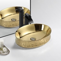 Lavabo à main en céramique dorée avec égouttoir pour hôtels et salles de bains Luxe moderne ovale Art au-dessus du comptoir