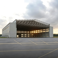 Hangar d'avion moderne à grande portée sans colonnes en structure acier anti-corrosion, protection incendie, revêtement de sol époxy haute résistance, garantie 20 ans
