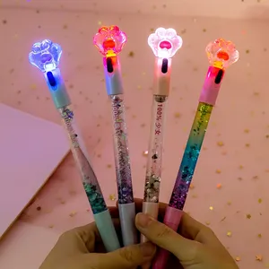 2024 Schattige Vloeibare Folie Metalen Balpennen Kattenpoot Glanzende Lichtgevende Balpennen Briefpapier Schoolbenodigdheden Drijvende Glitter Pen