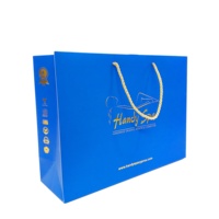 Vente en gros de grands sacs en papier cadeau avec logo de marque de luxe estampage à l'or personnalisé