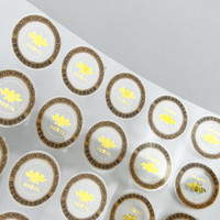 Autocollants personnalisés en feuille d'or à chaud hautement transparents, résistants à l'eau, à l'huile et aux UV pour l'emballage des cosmétiques