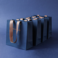 Sacs cadeaux de luxe en papier kraft bleu roi avec logo personnalisé et poignée en ruban, sans minimum de commande, en pâte de bois vierge de qualité supérieure pour montres et lunettes