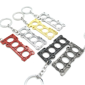 Portachiavi Mini Auto con Griglia Paraurti Anteriore, Volante da Corsa, Modello Testa Cilindro Turbo e Guarnizione Motore - Product Image 2