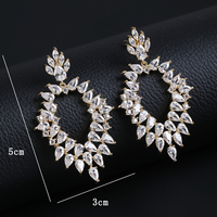 Nouvelles boucles d'oreilles pendantes en cristal de zircone cubique brillant, style brésilien, forme de plante, longues, dorées, tendance, pour dîner féminin