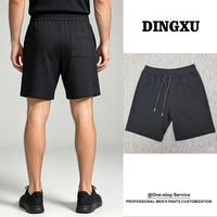 Shorts en maille texturée pour homme, noir, taille élastique, cordon de serrage intérieur, poche arrière, poche latérale, coupe ample, mi-cuisse, décontracté, style sweat