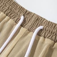 Shorts de jogging pour hommes en nylon personnalisés avec taille élastique pour l'entraînement en plein air et le cyclisme