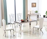 Ensemble de table à manger moderne de luxe en acier inoxydable avec dessus en marbre pour le salon ou la cuisine de l'appartement