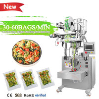 Machine d'emballage entièrement automatique verticale pour sachets à scellage 4 côtés, idéale pour les granulés, épices, et assaisonnements de nouilles instantanées.