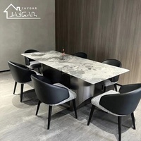 Fournisseur de chaises de restaurant, chaises de salle à manger rembourrées en cuir PU noir de luxe léger avec accoudoirs, style moderne, chaise de designer italienne